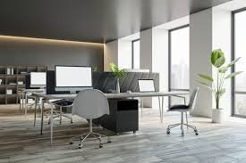 Clean, modern office space with desks and large windows